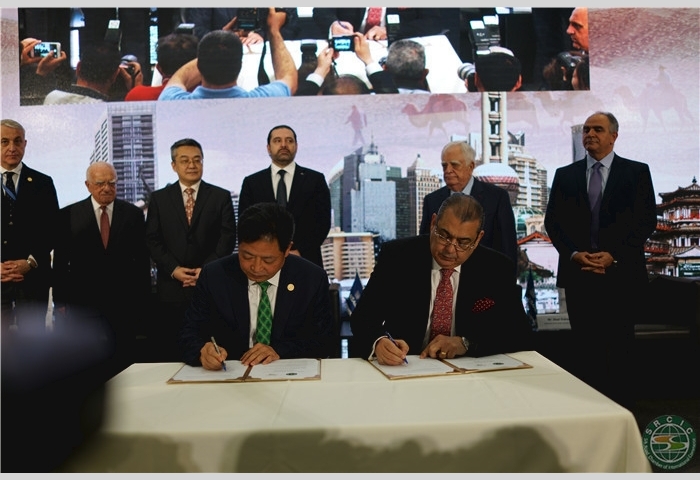 8--Mr. Lu signs the strategic cooperation agreement with Mr. Nael Kabariti, Chairman of the General Union of Arab Chambers